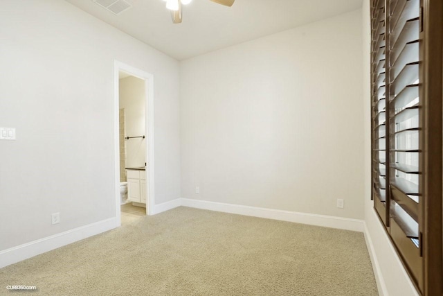 carpeted spare room with ceiling fan