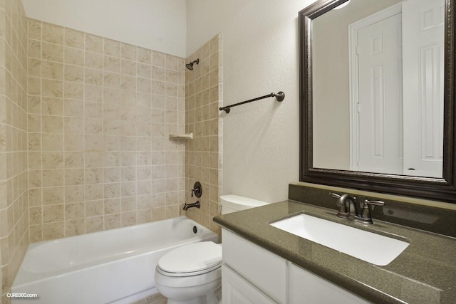 full bathroom with vanity, toilet, and tiled shower / bath