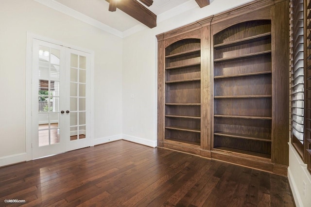 unfurnished room with crown molding, ceiling fan, beam ceiling, dark hardwood / wood-style flooring, and french doors