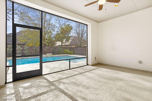 unfurnished room with carpet and ceiling fan