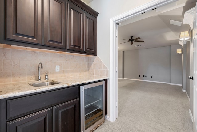 139 Monterrey Bnd, Montgomery, TX 77316 - bar featuring wine cooler, a sink, light carpet, and decorative backsplash
