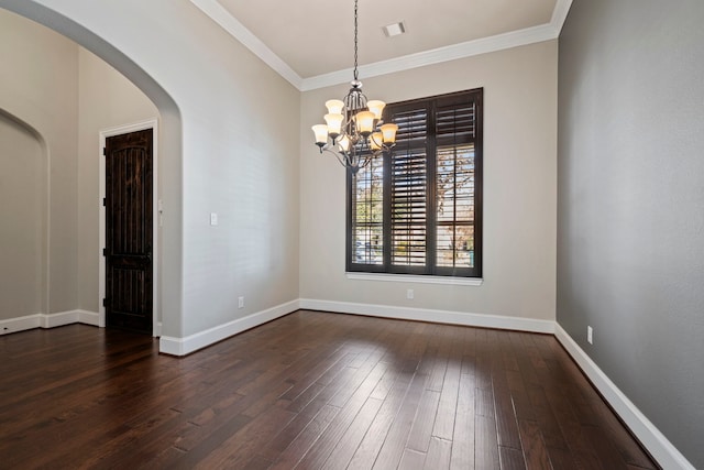 139 Monterrey Bnd, Montgomery, TX 77316 - unfurnished room featuring visible vents, baseboards, an inviting chandelier, arched walkways, and dark wood finished floors