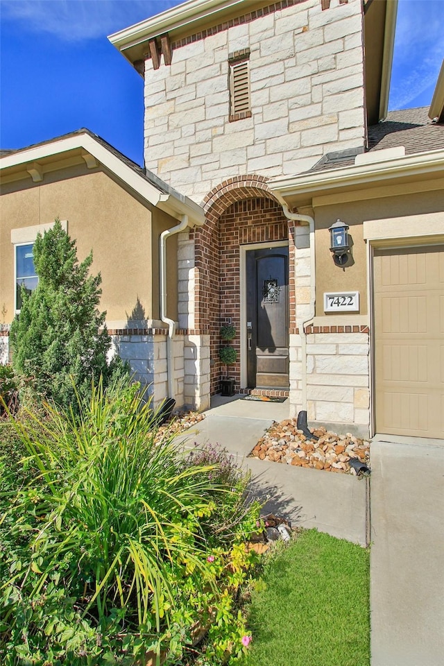 entrance to property featuring a garage