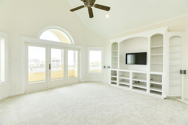 unfurnished living room with ceiling fan, light carpet, and high vaulted ceiling