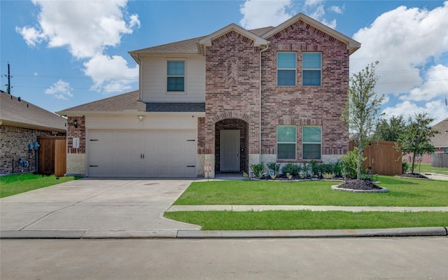 view of front property with a garage and a front yard