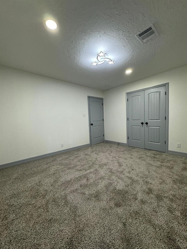 interior space with a textured ceiling