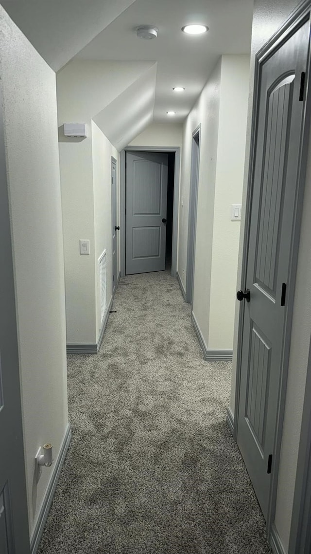 hallway with light carpet