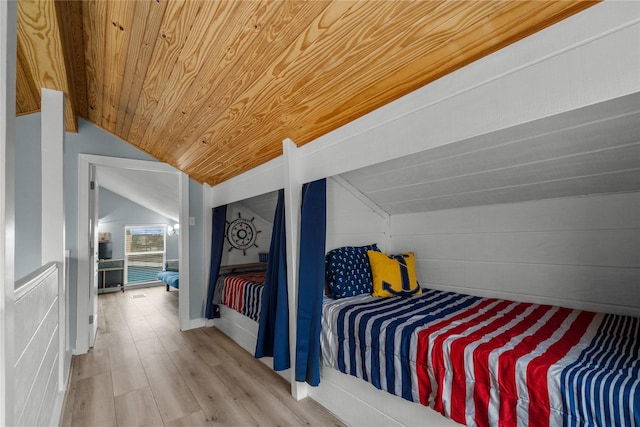 bedroom with wood ceiling, vaulted ceiling, and hardwood / wood-style flooring