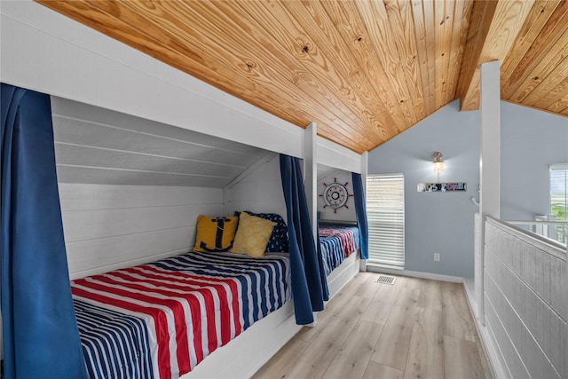 bedroom with hardwood / wood-style flooring, vaulted ceiling, and wood ceiling