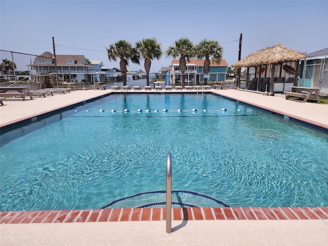 view of swimming pool featuring a gazebo and a patio