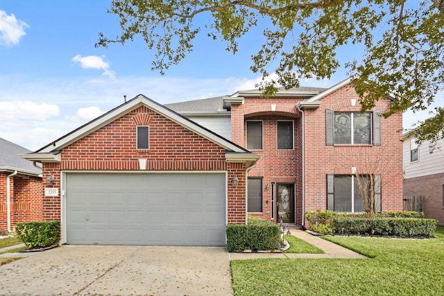 view of property featuring a garage and a front lawn