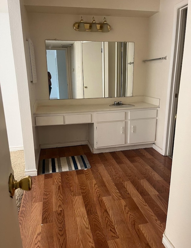 bathroom featuring wood-type flooring and vanity