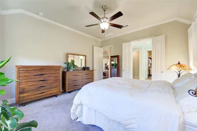 bedroom featuring visible vents, light colored carpet, ceiling fan, vaulted ceiling, and crown molding