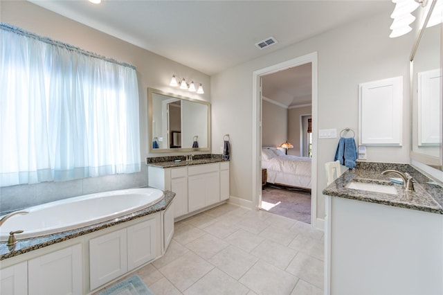 bathroom featuring ensuite bath, visible vents, two vanities, and a sink