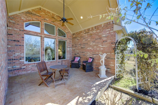 view of patio / terrace featuring fence and a ceiling fan