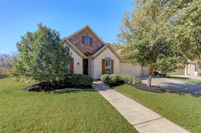 view of front of home featuring concrete driveway, stone siding, an attached garage, a front lawn, and brick siding