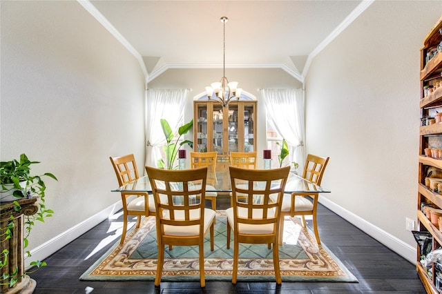 dining space featuring baseboards, lofted ceiling, dark wood-style floors, ornamental molding, and a chandelier