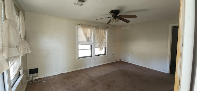 carpeted empty room featuring ceiling fan