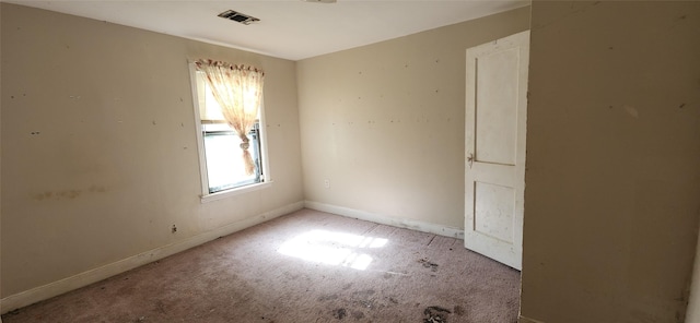 carpeted empty room with a wealth of natural light