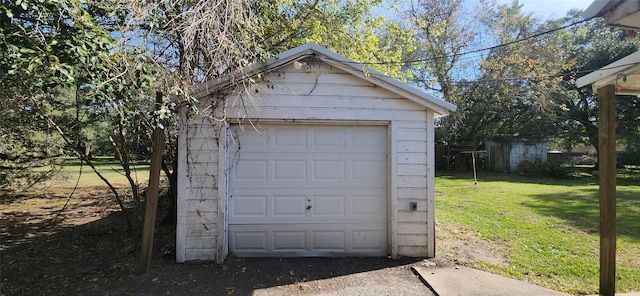 garage with a lawn