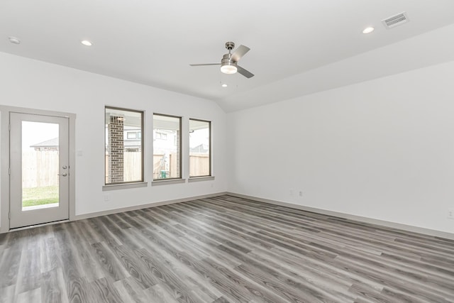 unfurnished room with ceiling fan, lofted ceiling, and light hardwood / wood-style floors