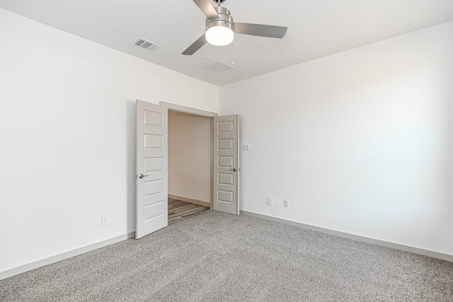 unfurnished bedroom with carpet floors and ceiling fan