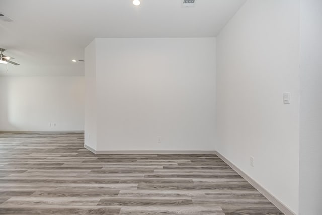 empty room featuring light hardwood / wood-style floors and ceiling fan