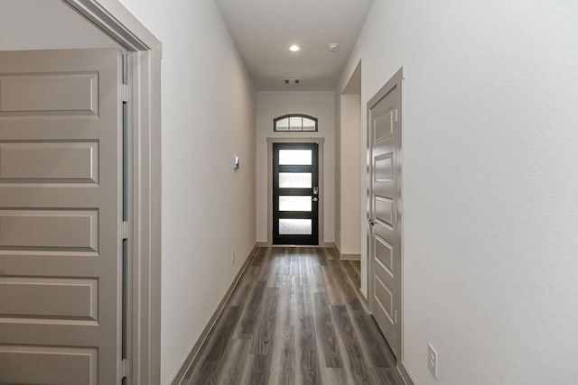 doorway to outside with dark hardwood / wood-style floors