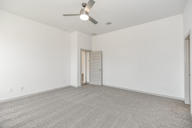 carpeted empty room featuring ceiling fan