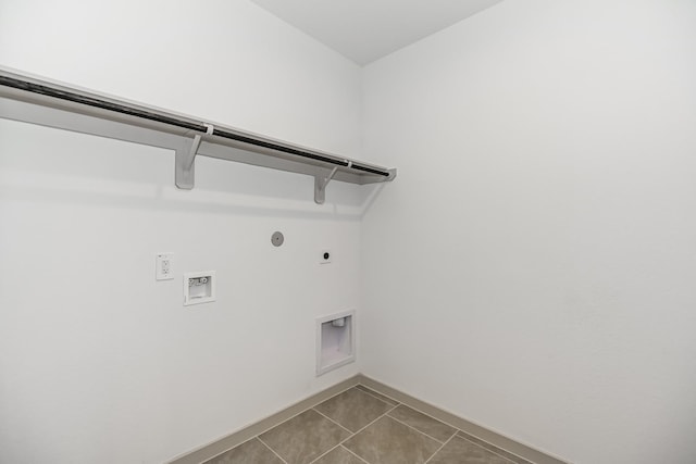 clothes washing area featuring electric dryer hookup, washer hookup, hookup for a gas dryer, and tile patterned floors