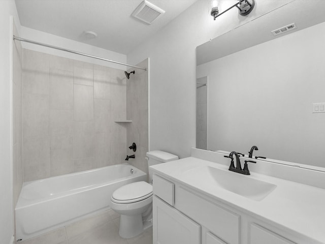 full bathroom featuring vanity, toilet, tiled shower / bath combo, and tile patterned flooring