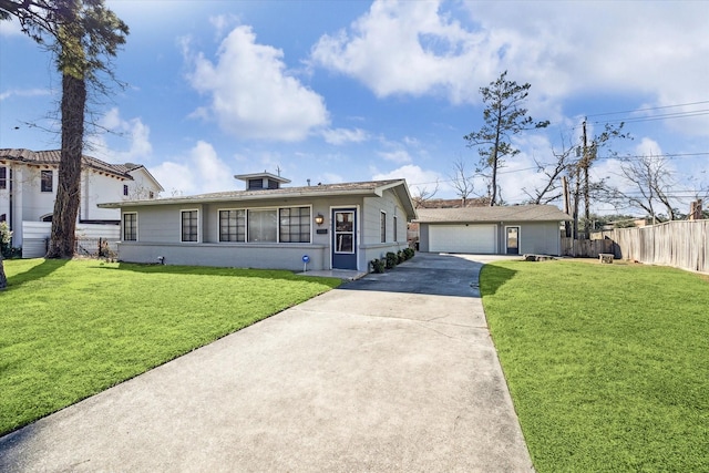 view of front of property featuring a garage and a front lawn