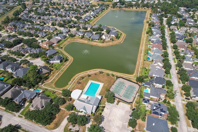 bird's eye view featuring a residential view and a water view