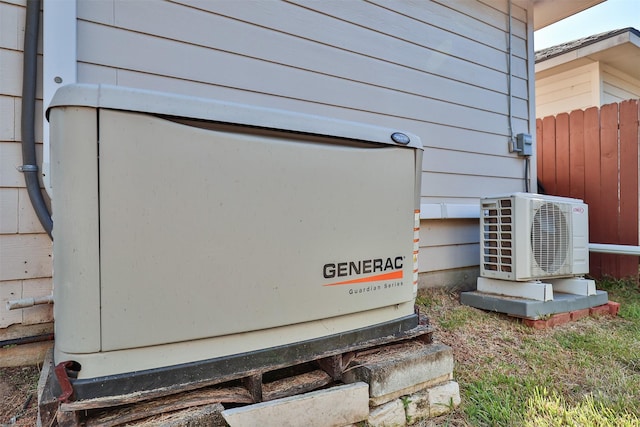 details featuring ac unit, a power unit, and fence