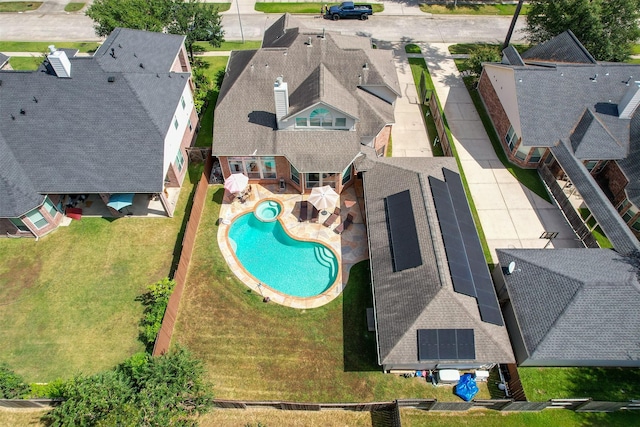 exterior space featuring a yard and a residential view