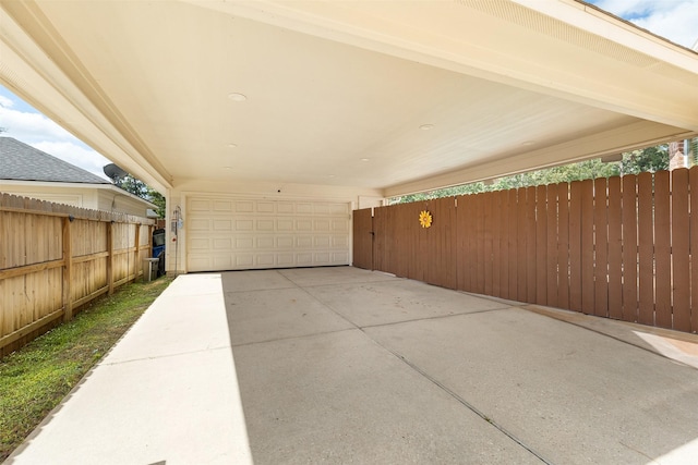 view of patio with a garage and fence