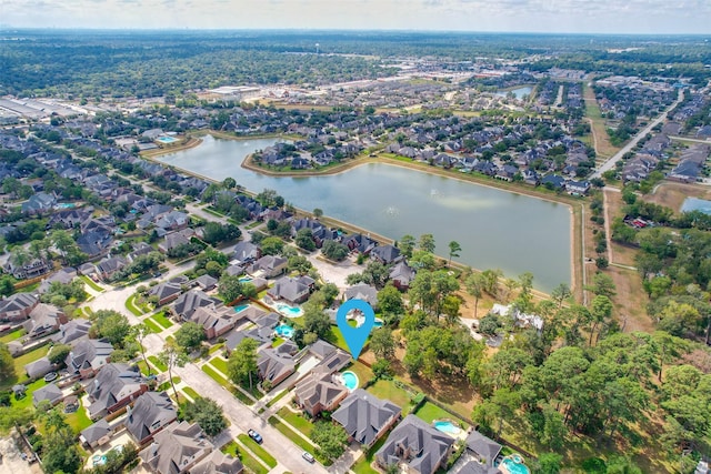 birds eye view of property with a residential view and a water view