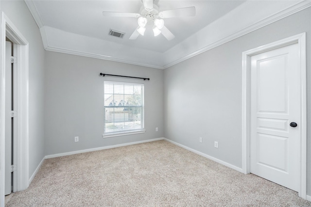 empty room featuring visible vents, crown molding, ceiling fan, baseboards, and carpet