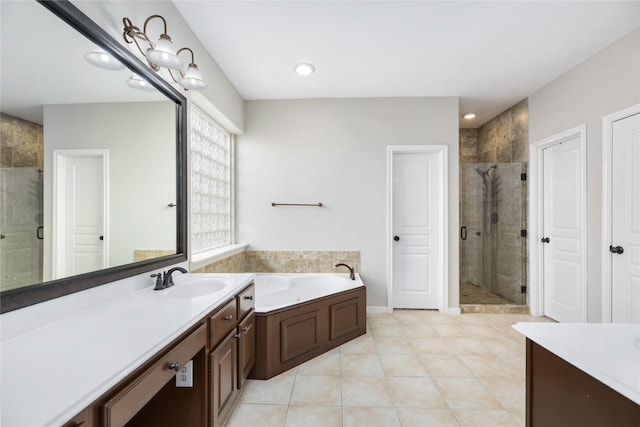 bathroom featuring tile patterned flooring, a shower stall, a garden tub, recessed lighting, and vanity