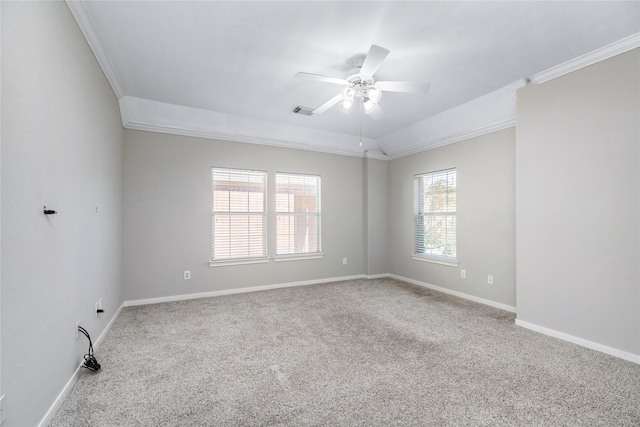 unfurnished room with visible vents, baseboards, carpet floors, ceiling fan, and ornamental molding