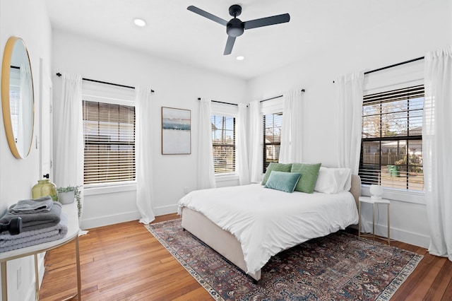 bedroom featuring hardwood / wood-style flooring and ceiling fan