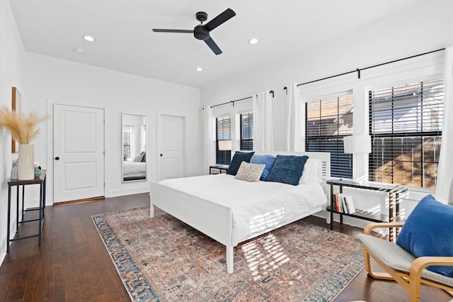 bedroom featuring dark hardwood / wood-style floors and ceiling fan