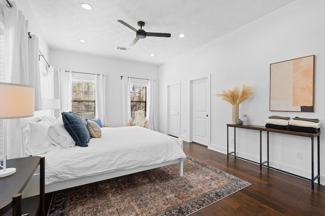 bedroom with ceiling fan and dark hardwood / wood-style floors