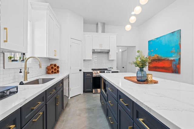 kitchen featuring sink, white cabinets, stainless steel appliances, and decorative light fixtures