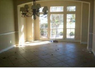 unfurnished dining area featuring a chandelier