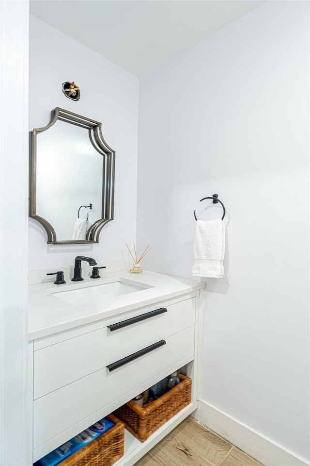 bathroom featuring vanity and hardwood / wood-style floors