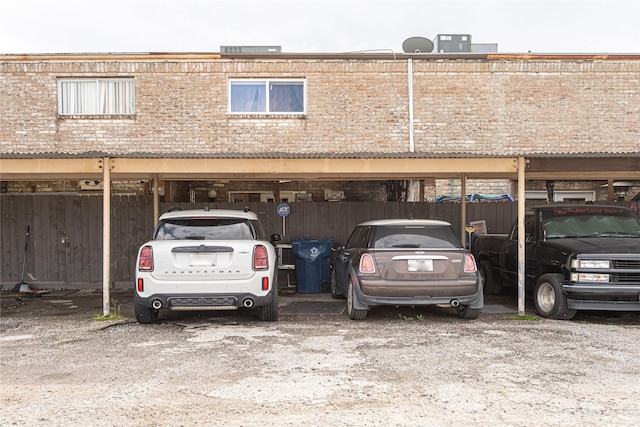 view of parking / parking lot featuring a carport