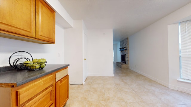 hall featuring light tile patterned floors