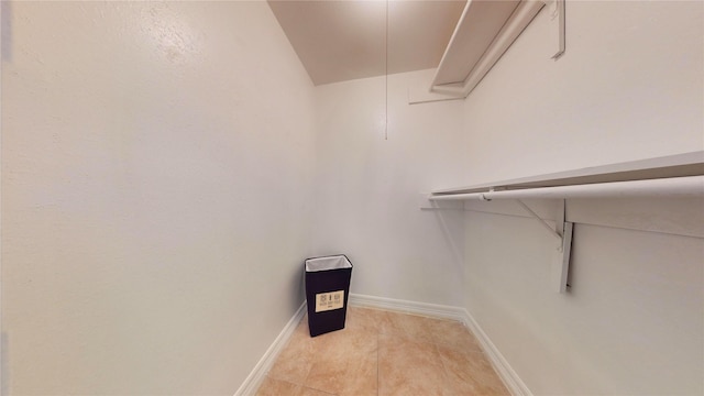 spacious closet featuring light tile patterned floors