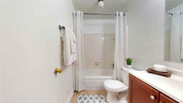 full bathroom with tile patterned flooring, vanity, toilet, shower / bath combo, and a textured ceiling